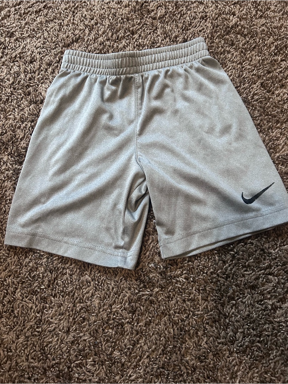 Nike KidsLight Gray Athletic Shorts with Black Swoosh